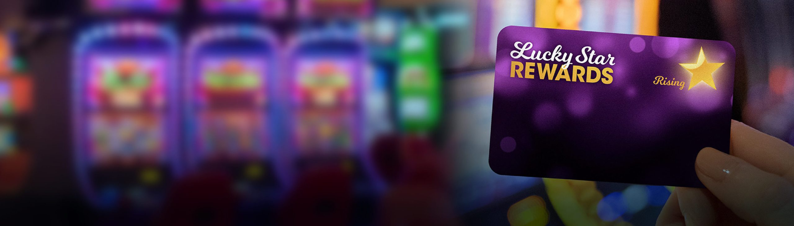 Lucky Eagle Casino Lucky Star Rewards card being held in front of slot machines